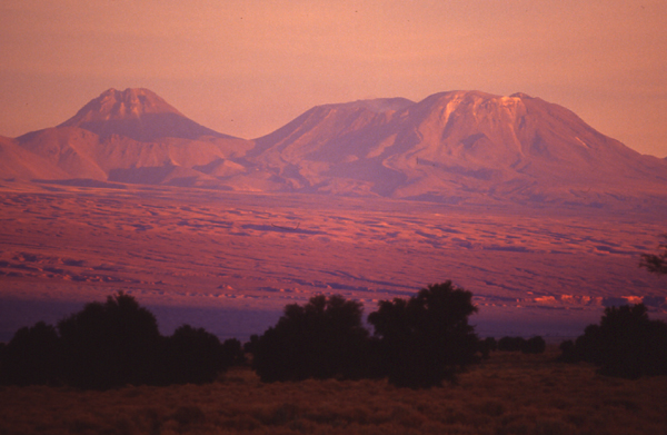 Lascar on the right at sunset from San Pedro de Atacama.